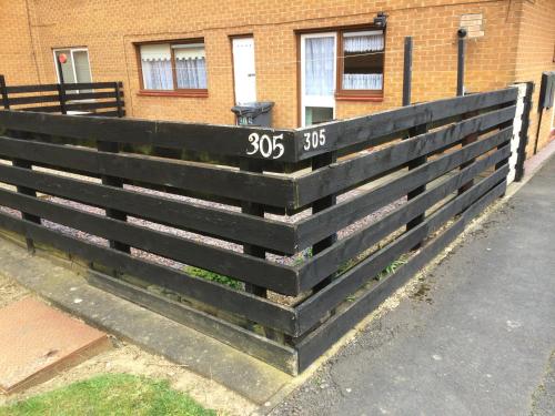 a black fence in front of a building at Morrison Close in Newton Aycliffe