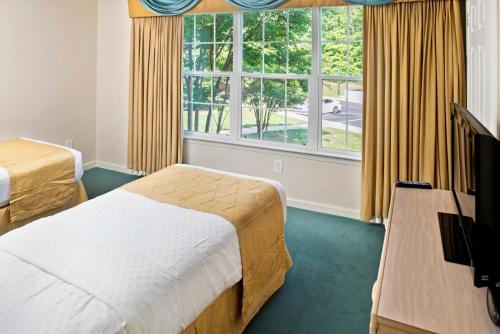 A bed or beds in a room at Greensprings Vacation Resort