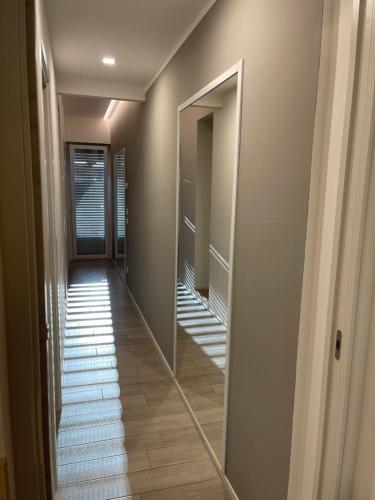 a hallway with a mirror on the wall at Il Parco di Yuki (3) in Ancona