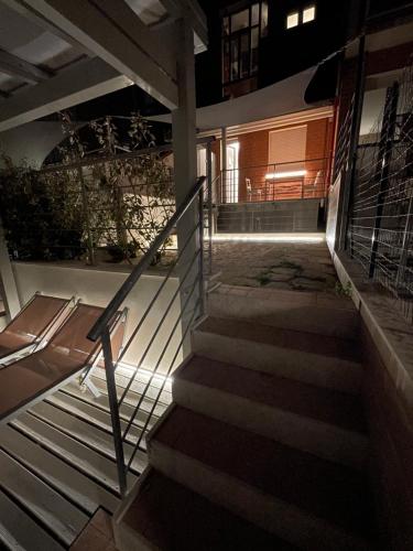 a set of stairs leading to a building at night at Il Parco di Yuki (3) in Ancona