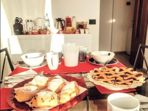 a table with two plates of bread and cookies at B&B Ca' Nobil in Bernate Ticino