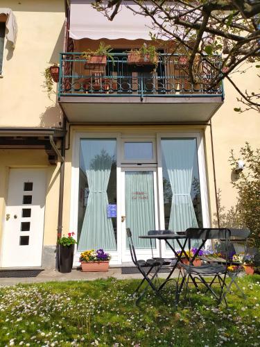 a table and chairs in front of a house at B&B Ca' Nobil in Bernate Ticino