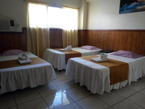 Voodi või voodid majutusasutuse Hotel Manantiales El Salvador toas