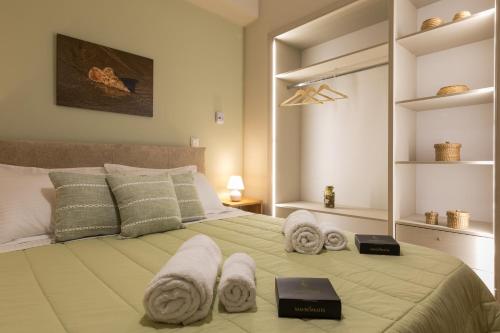 מיטה או מיטות בחדר ב-UniQApt
