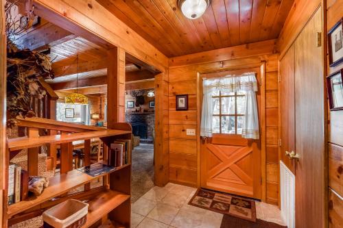a wooden hallway with a wooden door in a house at Williams Cabin in Shaver Lake