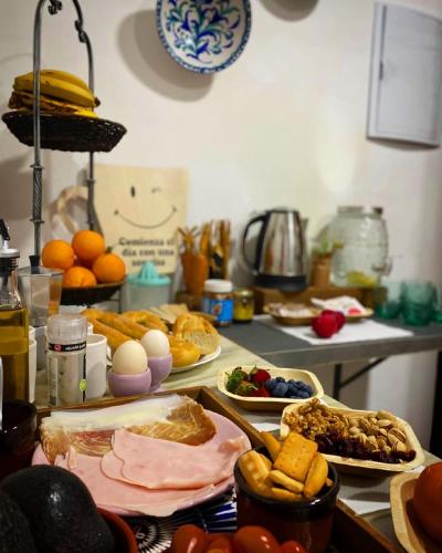 a kitchen counter with many plates of food on it at Finca Las Fuentezuelas in Carataunas
