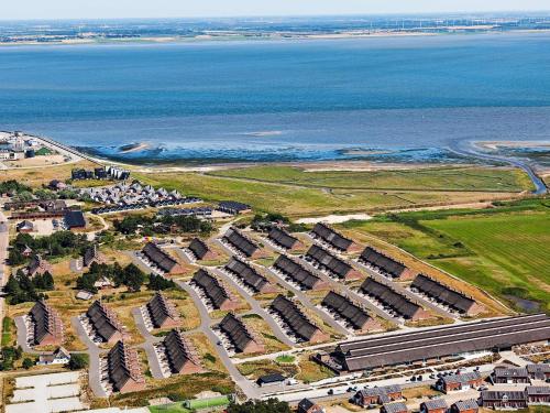 an aerial view of a large apartment complex next to the water at 4 person holiday home on a holiday park in R m in Sønderby