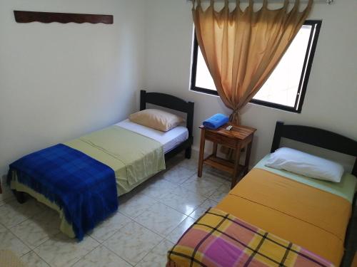 Katil atau katil-katil dalam bilik di Hostal La Casa de Luis