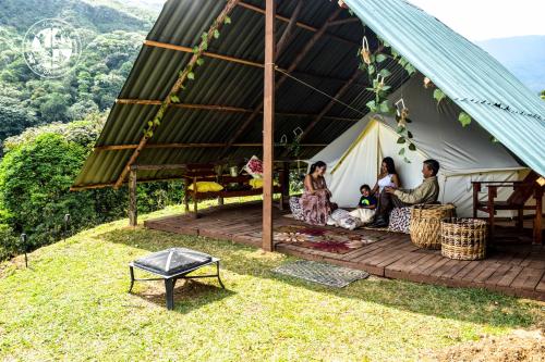 a group of people sitting in a tent at BOSQUE EL DESCANSO in Jamundí