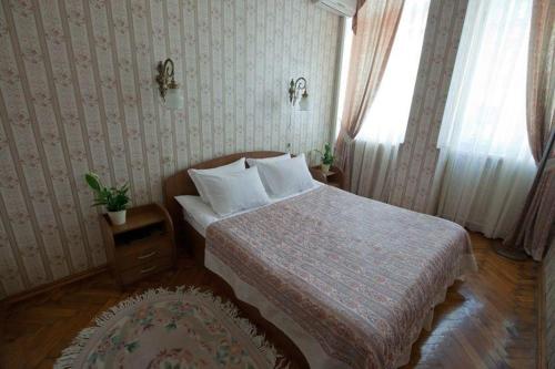 Säng eller sängar i ett rum på Volga Hotel