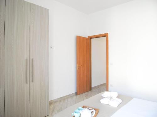 A bed or beds in a room at Appartamenti Via Corfù - Le vie di Omero