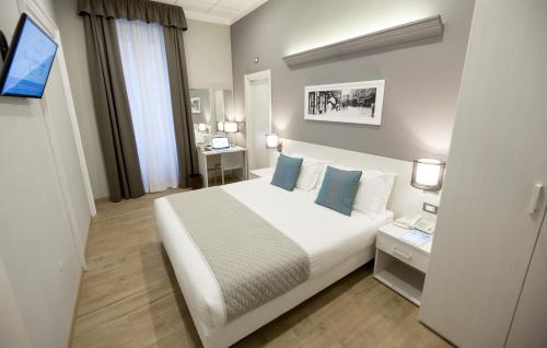 מיטה או מיטות בחדר ב-Nuovo Albergo Centro