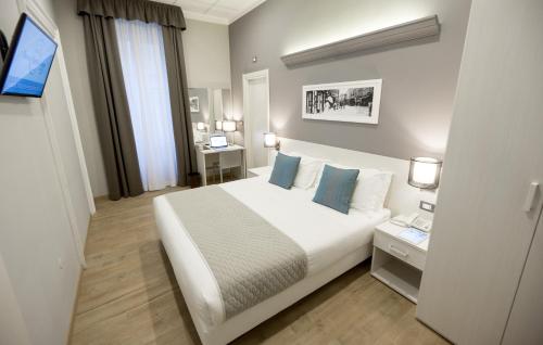 Posteľ alebo postele v izbe v ubytovaní Nuovo Albergo Centro