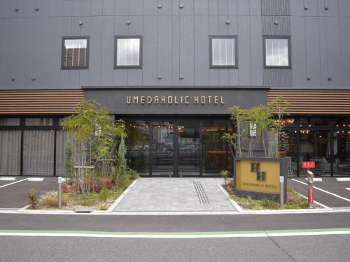a building with the entrance to alde graduate hotel at UMEDAHOLIC HOTEL in Osaka