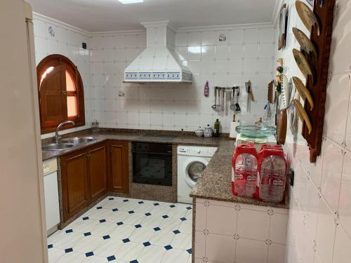 a kitchen with a sink and a dishwasher at VERDEPLAYA in Matalascañas