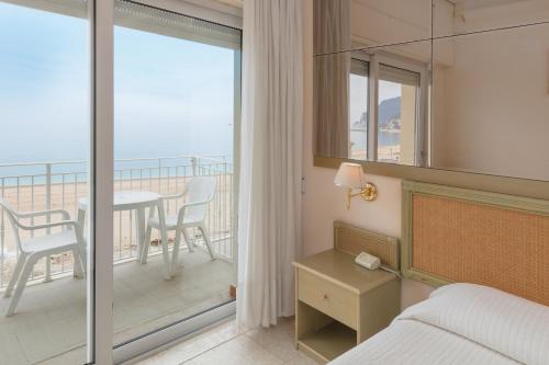 Postel nebo postele na pokoji v ubytování Hotel Numana Palace