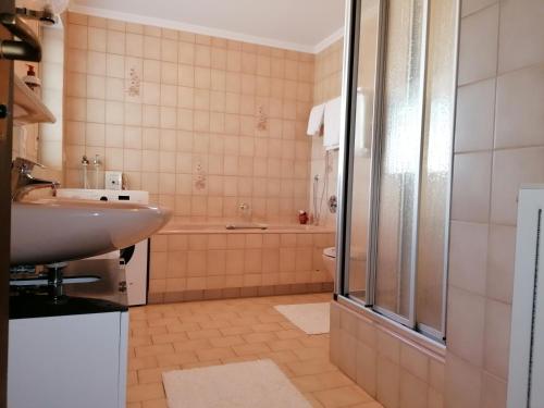 a bathroom with a sink and a shower at FeWo mit Burgblick in Kreuzwertheim