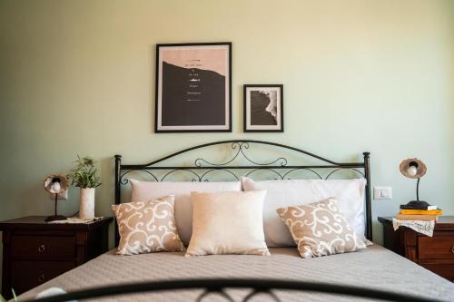 a bedroom with a bed with pillows on it at Il Madrigale - Agriturismo B&B in Agnone