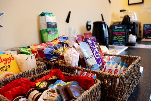two baskets filled with food and drinks on a counter at Gowanlea Heights in Campbeltown