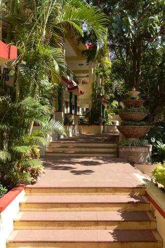a set of stairs in front of a building at Adamo the Resort in Matheran