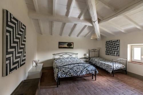 เตียงในห้องที่ Villa Liberty Mugello - Affitti Brevi Italia