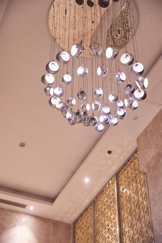 a chandelier hanging from the ceiling in a room at The P L Palace Agra in Agra