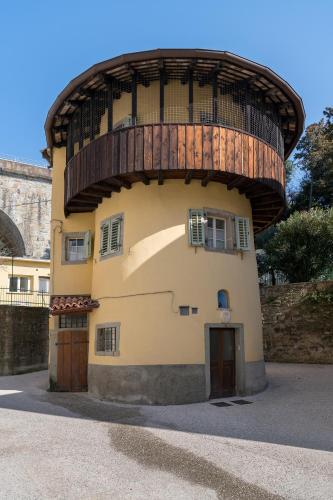 a round building with a wooden dome on top at Residence La Torre con private park in Trieste