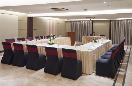 a conference room with a long table and chairs at The P L Palace Agra in Agra