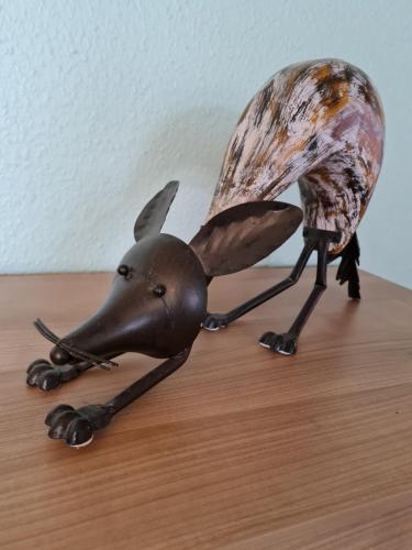 a figurine of a dog on a table at Ferienwohnungen Abendsonne - 8 Gehminuten zum EP in Rust