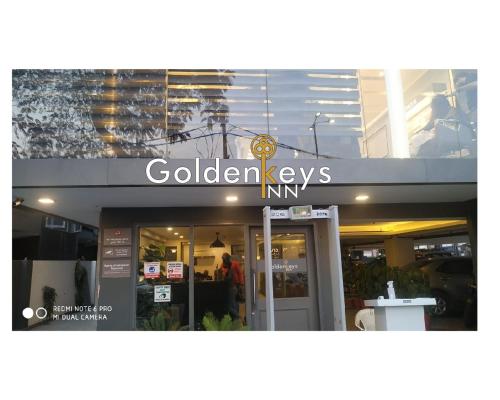 a store with a sign on the front of a building at GoldenKeys Inn in New Delhi