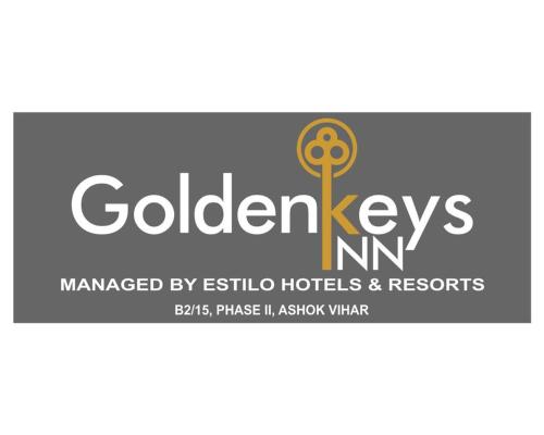 a logo for a golden keys nm at GoldenKeys Inn in New Delhi