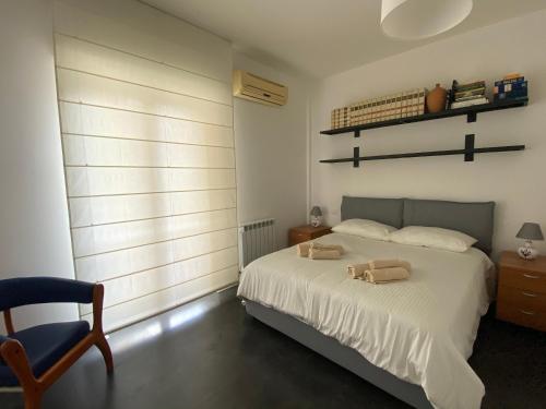 Ένα ή περισσότερα κρεβάτια σε δωμάτιο στο Casa Genia a due passi dal Teatro Greco