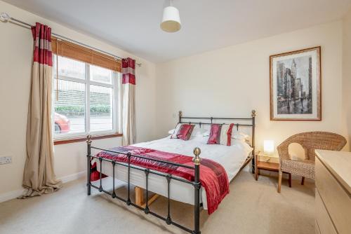 a bedroom with a bed and a window at 2 Bedroom Apartment in a Quiet Neighbourhood in St. Andrews