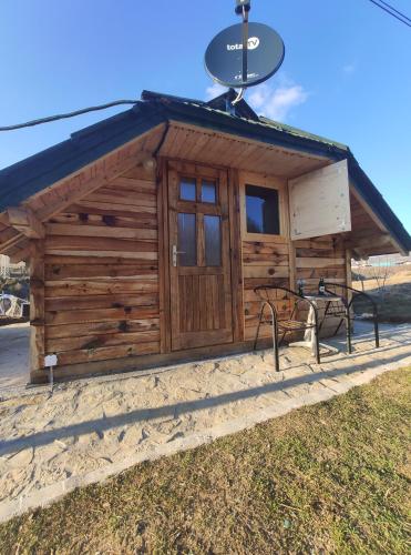 a log cabin with a sign on top of it at Brvnara Krin 2 in Nova Varoš