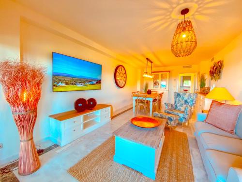 a living room with a couch and a table at Amazing Sea View La Hacienda Alcaidesa Links Golf Beach Resort in La Alcaidesa