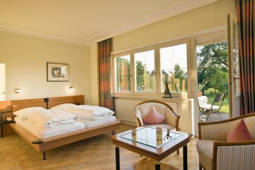 Postel nebo postele na pokoji v ubytování Reck's Hotel-Restaurant