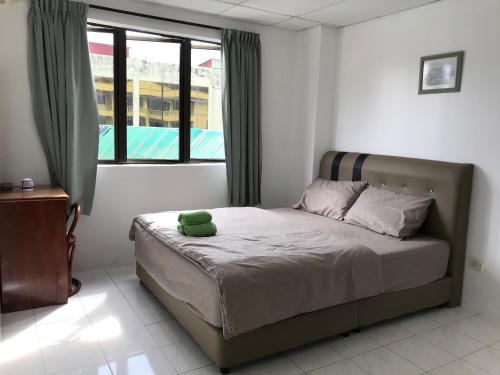 Ένα ή περισσότερα κρεβάτια σε δωμάτιο στο Pangkor Coralbay Resort 201 apartment