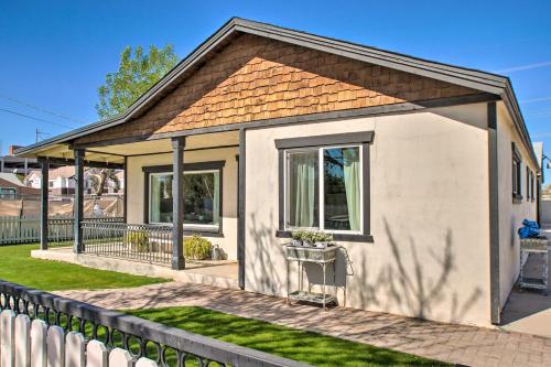 a small white house with a fence at Walk to Downtown Gilbert Home with Fire Pit! in Gilbert