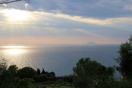 a view of the ocean under a cloudy sky at Case di Berto in Capo Vaticano