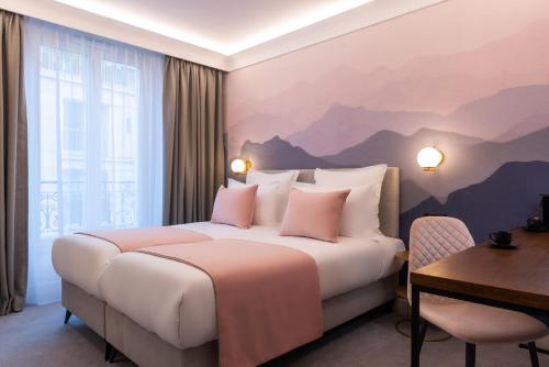 Ein Bett oder Betten in einem Zimmer der Unterkunft Hôtel Le Milie Rose