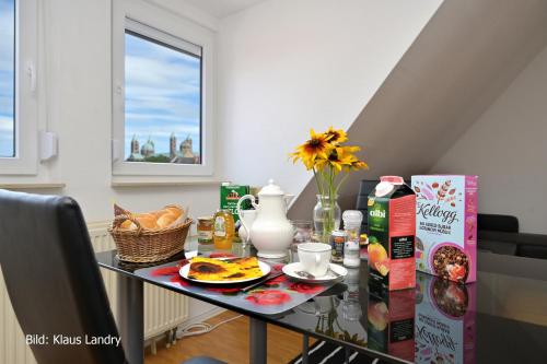 a dining room table with food on it at Domizil Domblick Speyer City, Garage, 50m2 in Speyer