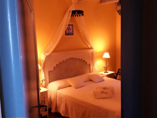 Ένα ή περισσότερα κρεβάτια σε δωμάτιο στο Marulivo Hotel
