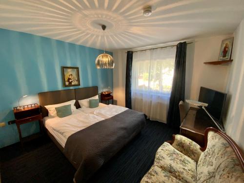 Postel nebo postele na pokoji v ubytování Hotel Attaché