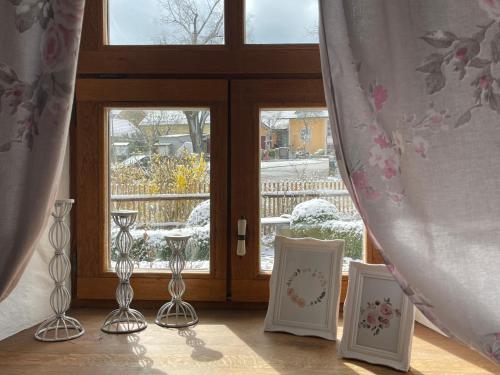 a room with a window with two chairs and a table at Jurahaus Hirschberg EG Wohnung in Beilngries