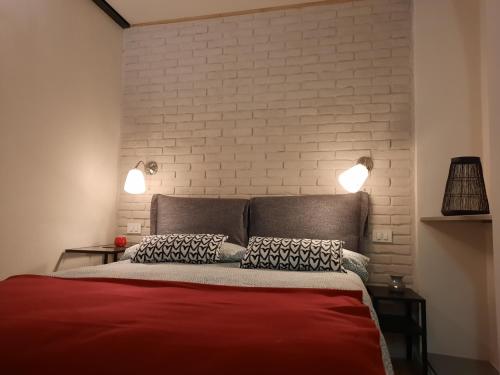 מיטה או מיטות בחדר ב-MINI CONTRA' DEI SERVI - VICENZA