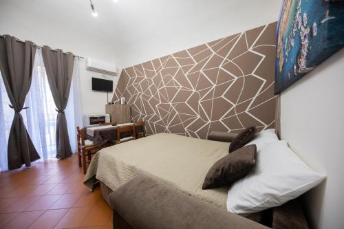 Ένα ή περισσότερα κρεβάτια σε δωμάτιο στο Casa Ruggero