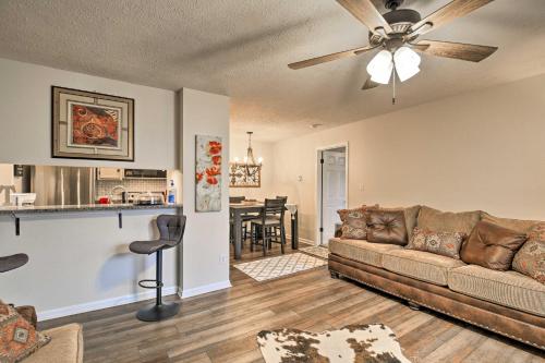 a living room with a couch and a ceiling fan at Deck and Grill Modern Sugar Mtn Escape! in Sugar Mountain