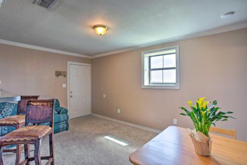 a living room with a table and a couch at Remodeled Ranch Apt in Sanger 12 Mi to Lake! in Sanger