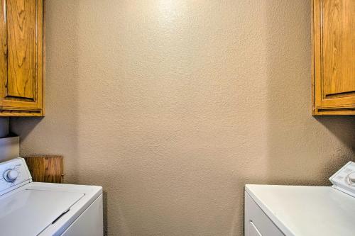 a laundry room with a washer and a washing machine at Remodeled Ranch Apt in Sanger 12 Mi to Lake! in Sanger