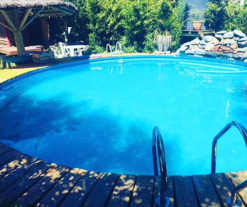 a large swimming pool with blue water at Posada Agua Marina in La Paloma